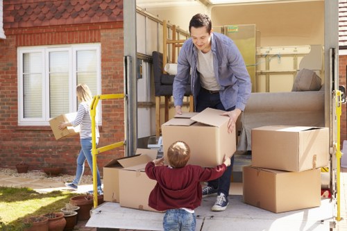 Business relocation setup with desks, boxes, and equipment in a new premises