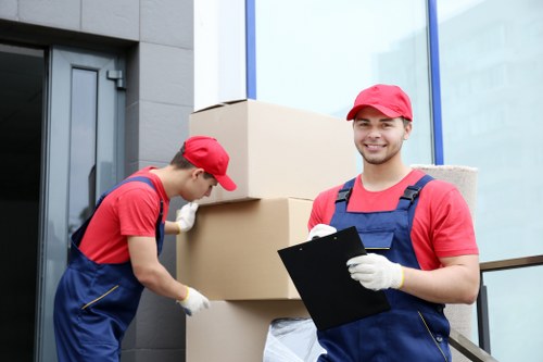 Removal team using safety-focused packing and lifting procedures