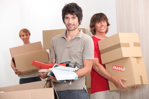Cardboard boxes, wrapped furniture, and moving supplies for a home relocation in Ireland