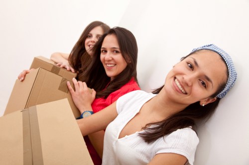 Moving crew measuring the volume of household items for a quote