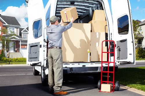Packed office furniture and labelled boxes ready for commercial transport